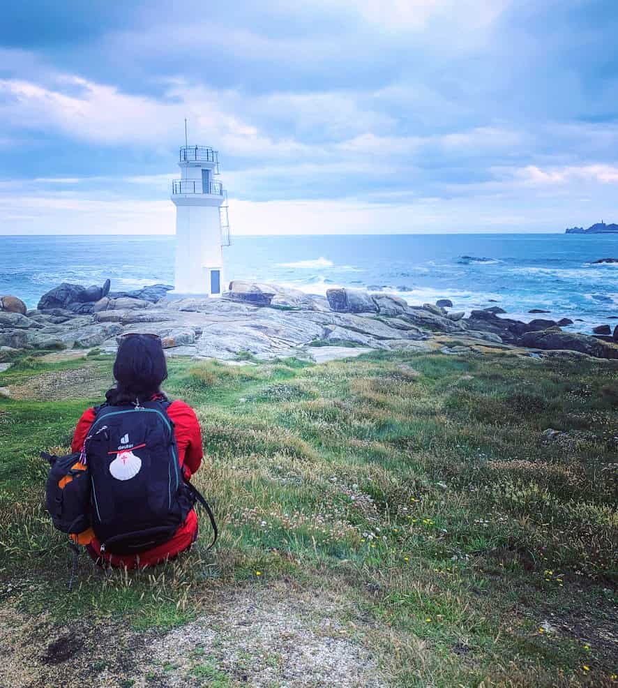 Milijana Gabrić sitting on the coast in Muxia in Galicia, Spain